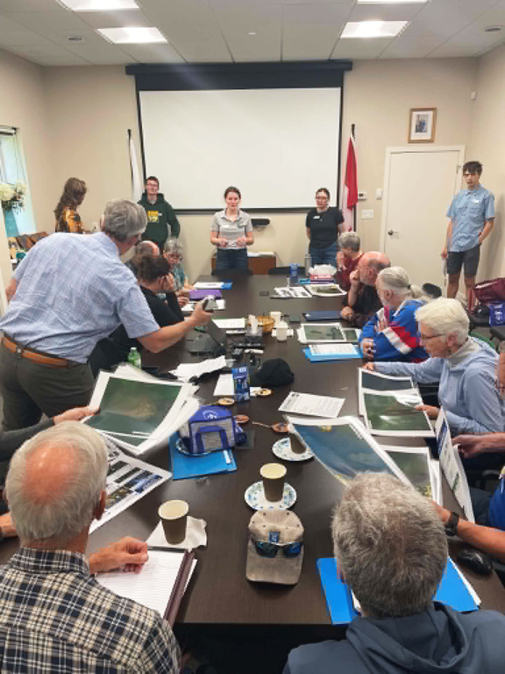 Granite Ridge students go over the finer points of drone photography with the lake associations