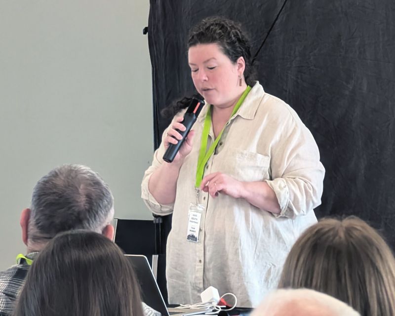 Katie Koopman addressing the crowded meeting
