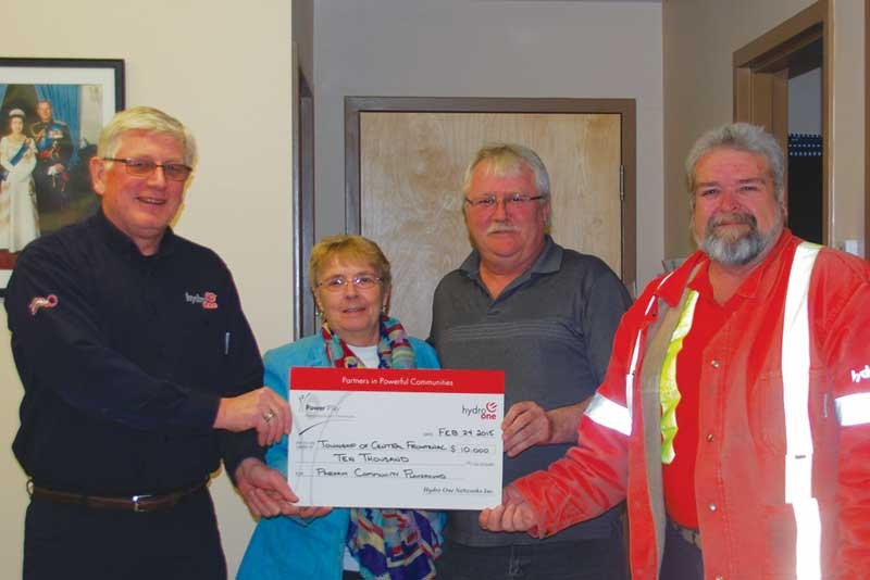 Hydro One donates $10,000 for play equipment at Parham ball field.