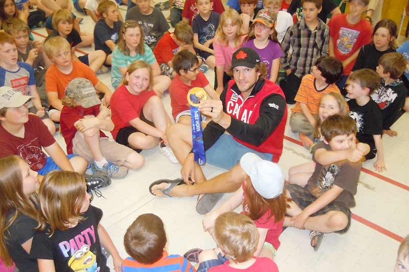 Olympic gold medalist Mike Smith surprises students at Prince Charles PS
