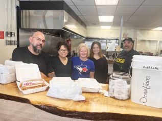 The Prime Take Out Crew take donations for the families of the Bobs Lake boat collision victims.