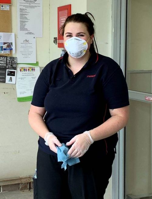 Chelsea, wiping down the cart handles & doors at Sydenham Foodland