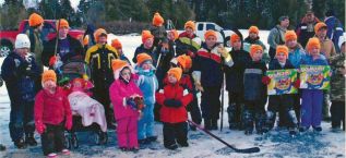 Children display prizes won at the 2013 Big Gull Lake Fishing Derby, sponsored by the Frontenac Addington Trappers Council.