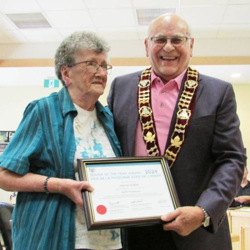 Harriett Riddell is presented the Senior of the Year award from Mayor Gerry Lichty