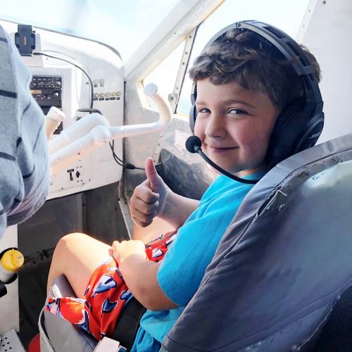 Alex McKeown, 8, got a surprise last Friday when Paul Snelgrove arrived at his dock in his de Haviland Beaver floatplane to take he and his family for their first ever areal tour of Bobs Lake, where their family has been cottaging for generations.