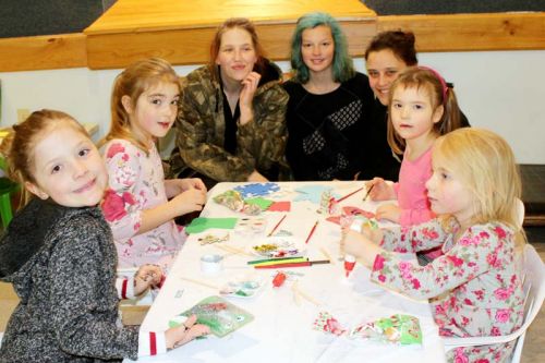 The crafts and games tables got a workout Sunday as these ladies at the Verona Christmas in the Village celebration will attest. Photo/Craig Bakay