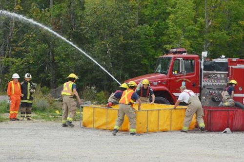 Crews setting up pools at the start of the Superior Water Shuttle Rating renewal for the CF fire department