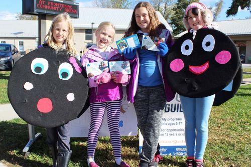 It was hard to resist the sales pitch of Girl Guides Caitlin Ball, Lilah Norton, Ella Eamer and Willa Morton Saturday in Sydenham. Photo/Craig Bakay