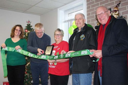 Ontario Trillium Foundation representative Bob Burge cuts the ribbon symbolizing the renovations at the Harrowsmith S & A Club Saturday along with S & A President Pam Morey, Treasurer Penny Lloyd, Mayor Ron Vandewal and Coun. John McDougall. Photo/Craig Bakay