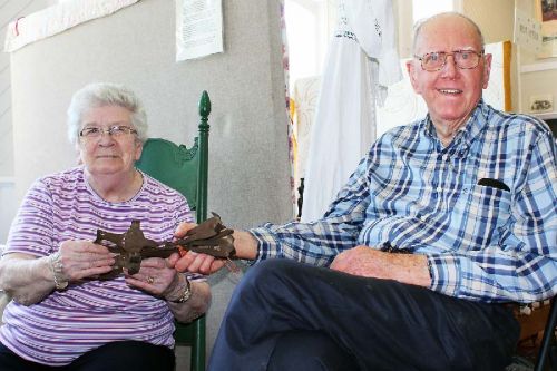 Glenn Snook presents museum board member Barb Stewart with a pair of spring skates that his grandfather kept for years. Photo/Craig Bakay