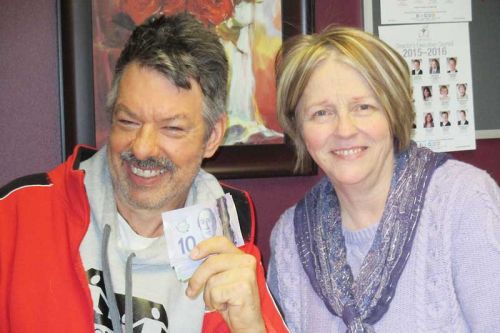 David giving $927 he made from this year's swim a thon to his alma mater, Clifford Bowey school in Ottawa. Pictured here are David and school secretary Jean Neidy