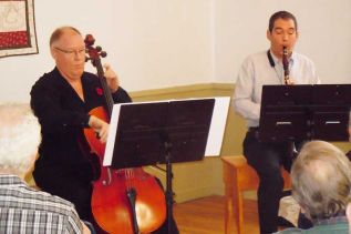 Capriccio's Rick Tersteeg (cello)and Tony Stuart (clarinet) with Val Leavitt (not shown in the photo) on piano received a standing ovation at MERA on November 10.