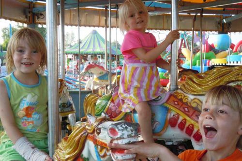 Calvin, Ezra and Cala Dark of Ottawa enjoyed a ride on the Merry-Go-Round at the 62nd annual Verona Lion's Jamboree