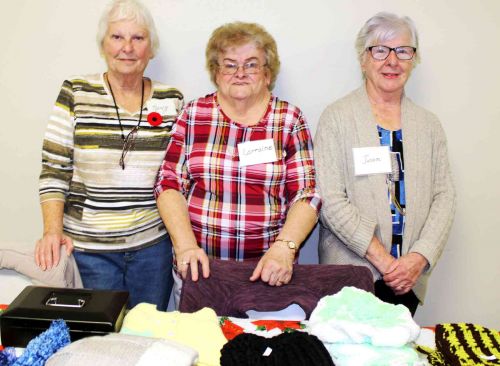 Nancy Hamilton, Lorraine Woods and Jean Myers were helping out with the knitted goods sales at St. Patrick’s Church in Railton. 