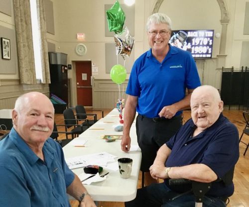 Executive Director David Townsend (standing) retires as head of Southern Frontenac Community Services this week.