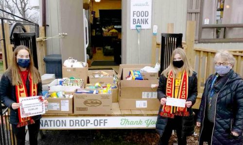 Students from the Recreation Leadership class at Sydenham high School delivering food donations (685lbs) and a cheque for $1181.20 to the Southern Frontenac Community Services Food Bank.