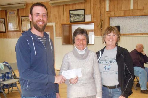 Rob Moore, who headed up the talent show at this year's FHF talent show, along with FHF chair Janet Gutowski present a cheque to Kim Cucoch, chair of the North Frontenac Food Bank.