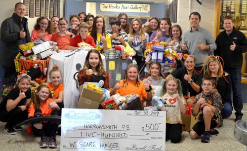 Harrowsmith Public School students and he Revell crew on orange and black day at the school