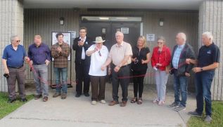 Two members of the founding arena committee, Marcel Giroux (with scissors) and Dave Hansen were front and centre as the Frontenac Community re-opened last Friday following extensive upgrades as well as the covid pandemic. Also pictured (from left) arena board member Coun. Norm Roberts, Coun. Doug Morey, arena supervisor Tim Laprade, Board Chair Brent Cameron, Giroux, Hansen, board member Sherry Whan, Coun. Pat Barr, board member Ray Leonard and SF Mayor Ron Vandewal. Photo/Craig Bakay