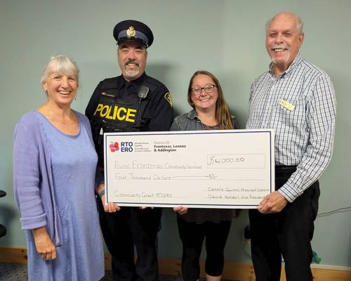 Cheque presentation at the Rural Frontenac Community Services office in Sharbot Lake. L to R: Louise Moody, Executive director, Constable Robert Martell, Frontenac County Community Liaison officer, Laura Huffman, Senior's Program Supervisor; Dennis Quinn, RTO president of district 20, Frontenac, Lennox & Addington.