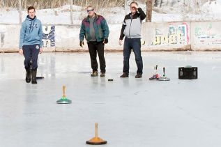 Even though there was a half inch of water on the rink in Tichborne, the Kingston & Area Ice Stock Club still managed to get a few games in for the Frontenac Heritage Festival Saturday. Photo/Craig Bakay