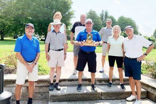 Two-thirds of the victorious North side socially distance and pose with the Mike Rawes Trophy after a hard fought nine holes.