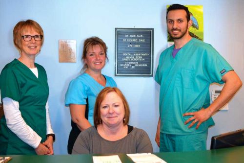 Dr. Faizi (far right) with staff of the Sharbot Lake Dental Clinic