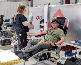 Frontenac Paramedic and voluteer firefighter, Ryan Conboy gives blood at the Sharbot Lake blood clinic, October 4.