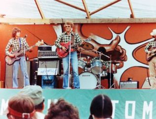 LtoR: Dennis Rowan (bass), Neville Wells (vocals, guitar), Peter Clements (drums), Al Webster (guitar), Band: Sweetwater performs at the Ompah Stomp 1978. Photo Don White