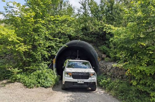 Joseph Cocchetto carefully drives the Frontenac County Truck through a culvert under Hiwy 7 with the 360 camera attached to the roof.