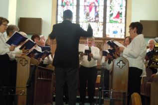 Brad Barbeau directs the community concert of the St. Mark Passion at St. Paul's in Sydenham on Good Friday.