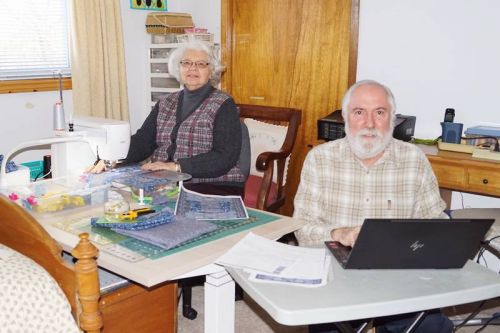 Doug and Christine Cromey making quilts for Quilts of Valor, an organization that donates quilts to wounded Canadian Armed Forces soldiers past and present.