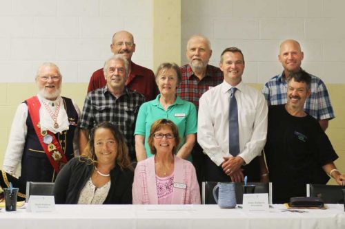 members of the CL-NF board, front row Tabitha Gibeault, Betty-Anne Blyth; middle row: Paddy O'Connor (doubling as the town crier), Vernon Hermer, Patty Hallgren, Dean Walsh (executive director), David Yerxa; back row Mark Hudson, Bob Miller, Paul Vanden Engel